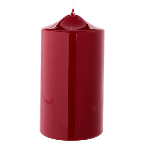 Red candle on a white background